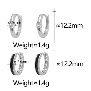 Detail of 925 silver hoop earrings with square zircon and black enamel inlay features