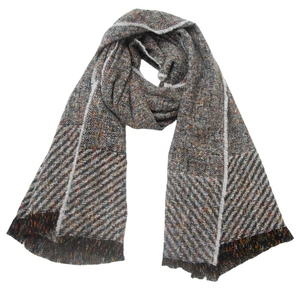 Close-up of multicolored herringbone knit shawl with classic short fringe details
