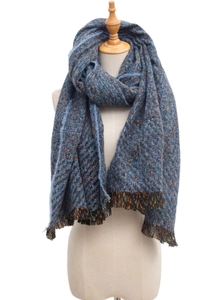 Detail of navy blue wool blend thick scarf featuring colorful tweed texture and tassels