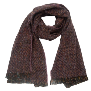 Macro detail of dark burgundy herringbone knit scarf with colorful specks and fringe