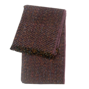 Close-up of deep purple knit scarf with multi-color speckles and fine fringe edge