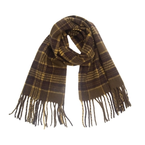 Detail of thick plaid scarf with tassels in dark brown, khaki, and bright yellow tones