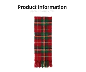 Detail of red and green plaid scarf featuring long fringes and soft cashmere texture