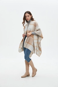 Detail of soft beige and brown plaid cashmere-like shawl with premium edge stitching
