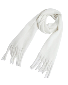Close-up detail of white chunky knit scarf showing thick braided tassel fringes texture