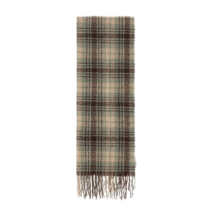 Close-up of beige and olive green plaid scarf showing soft fabric and tassel fringe