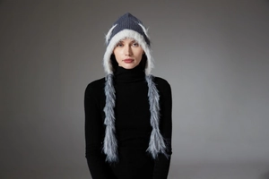 Detailed knit winter hat with cat ears and long faux fur tassels in grey and white