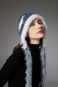 Close-up of winter knit hat featuring cat ears and gray blue faux fur earflaps