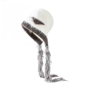 Detail of knit winter hat with white faux fur ears and long grey plush tassels