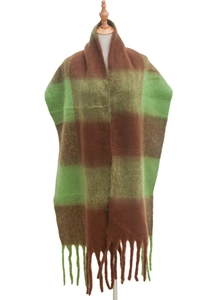 Close-up of thick winter scarf with green and brown wide stripes and long tassel details