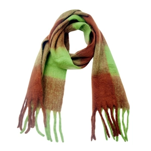 Macro detail of thick winter scarf featuring green and burgundy checkered blocks and long tassels