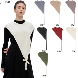Detailed palette of knit shawl wraps in eight colors featuring side tie-up ribbons