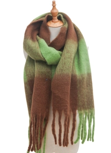 Detailed view of thick checkered scarf with long tassels in brown and grass green colors