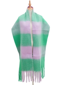Detail of green and purple plaid mohair scarf showing fringe and plush texture