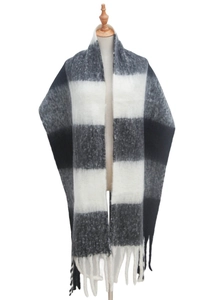 Detail of soft faux mohair texture on thick black and white plaid scarf with fringe