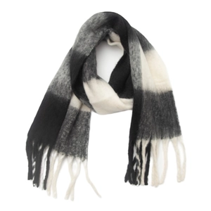Close-up of thick checkered scarf in black and grey with soft fringe details
