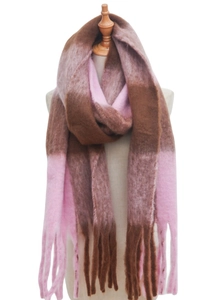 Macro shot of thick fringe details on a large pink and brown plaid mohair-style scarf