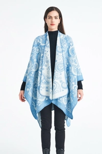 Detail of blue and white paisley jacquard wool blend shawl with irregular hem design