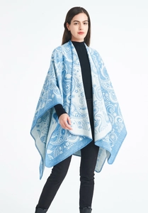 Detail of blue and white paisley pattern on wool jacquard shawl for women