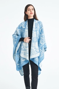 Detail of blue paisley wool shawl with fine stitching and soft jacquard texture