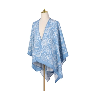 Detail of blue paisley wool jacquard pattern and edge stitching on women's cape shawl