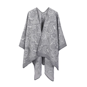 Close-up of grey and white paisley wool jacquard pattern on a soft knit shawl wrap