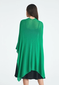 Detail of lime green lightweight mesh knit shawl showing airy texture and drape from back
