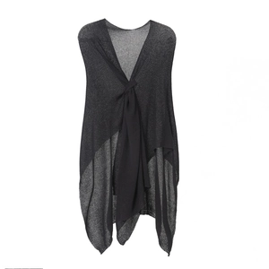 Detail of black knit shawl wrap featuring a central knot and asymmetric draped hem