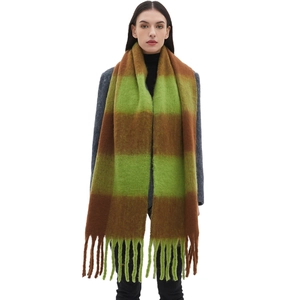 Thick oversized winter scarf with green and brown checkered pattern and fringe tassels