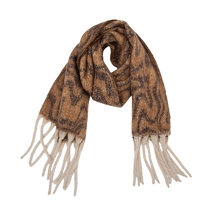 Detail of brown wavy knit scarf showing coffee geometric pattern and white thick tassels
