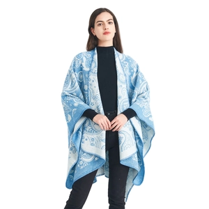 Women's light blue paisley wool jacquard knit poncho cape with a relaxed silhouette