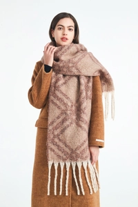Detail of chunky checkered scarf with fringe tassels on a brown wool coat ensemble
