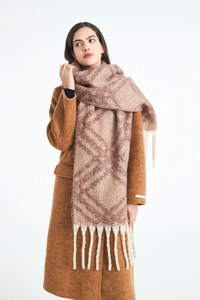 Close-up of thick plaid scarf with pink and brown diamond patterns and long tassels