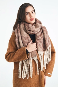Detailed texture of thick plaid scarf with long cream tassels on winter coat