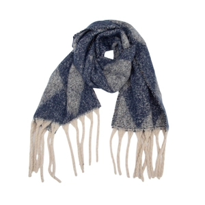 Detail of winter scarf featuring argyle knit pattern and chunky cream fringe tassels