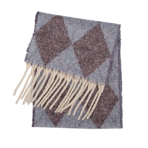 Detail of knit scarf featuring purple diamond patterns and white fringe trim texture