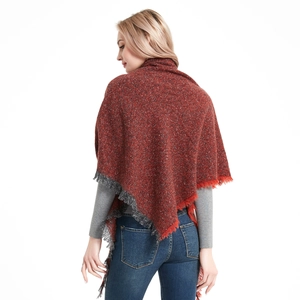 Women's autumn knit triangle shawl with fringe details in reddish brown color
