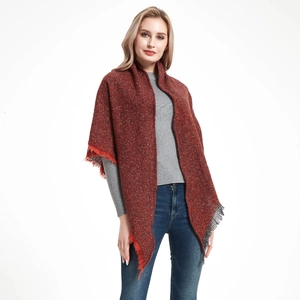 Women's knit triangle shawl scarf in reddish-brown textured yarn with fringe edges
