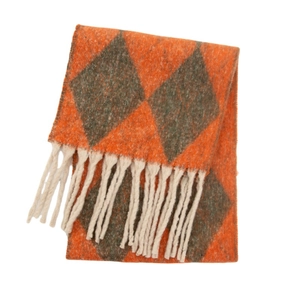 Detail of knit scarf with orange and grey diamond patterns and cream fringe