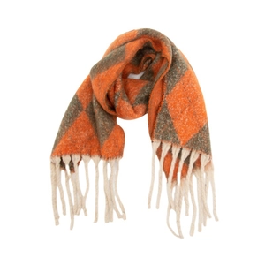 Close-up of thick winter scarf featuring orange argyle pattern and off-white fringe detail