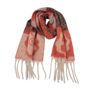 Detail of knit scarf showing orange floral jacquard pattern and twisted rope tassels