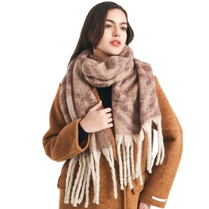 Winter chunky plaid scarf with long tassels worn with a brown coat for a cozy look