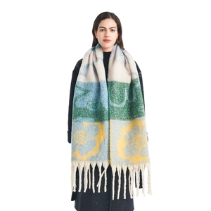 Thick mohair-like scarf with large floral jacquard pattern and long fringe tassels
