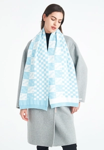 Detail of blue and white checkered knit scarf showing soft texture and ribbed edges