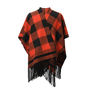 Close-up of the red and black buffalo plaid pattern and black fringe on this shawl