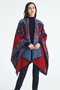 Detailed view of red ethnic jacquard shawl with geometric patterns and irregular fringe hem