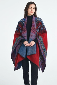 Close-up of ethnic jacquard knit shawl featuring red blue geometric patterns and tribal motifs