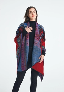 Close-up of geometric jacquard pattern on a warm red ethnic cashmere-feel shawl
