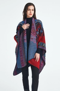 Detail view of ethnic jacquard knit shawl with vibrant red and purple geometric patterns