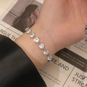 Elegant silver sparkling zircon tennis bracelet for women shown on a model's wrist